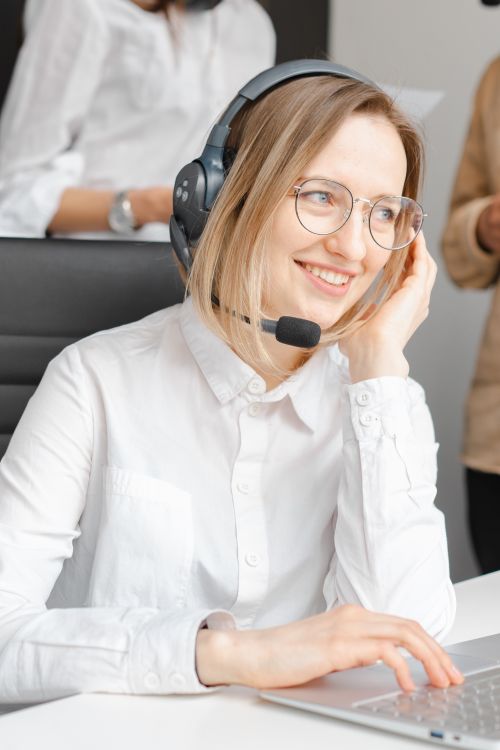 Call center agent wearing a headset assisting a customer