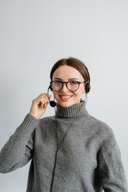 Customer support representative working at a desk with a headset